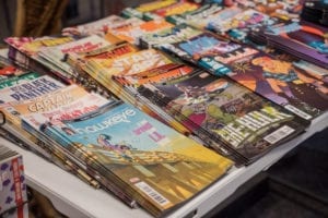 starbase comics subscription, table full of comics